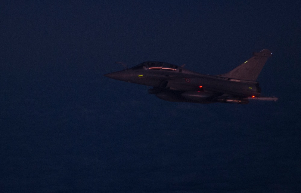 F-22 Raptors and Coalition Rafaels conduct airstrikes in Iraq and Syria