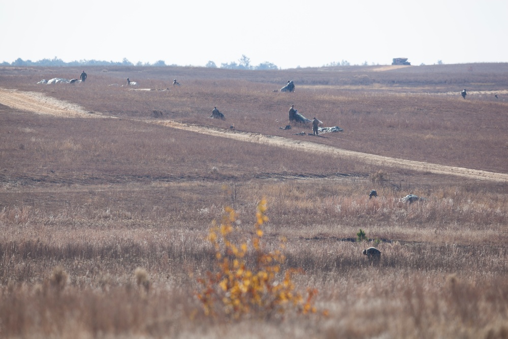 U.S Army Paratroppers landing after completing their jump in participation for the 20th Annual Randy Oler Memorial Operation Toy Drop, hosted by U. S. Army Civil Affairs &amp; Psychological Operations Command (Airborne), Dec. 01, 2017 on Sicily Drop Zone at F