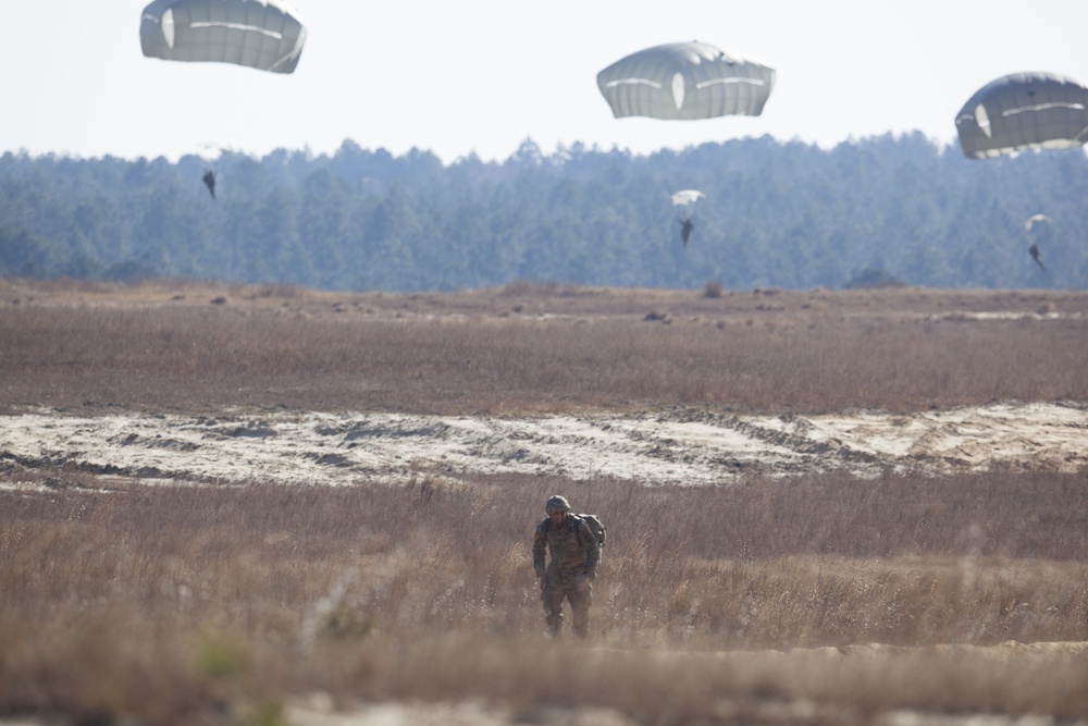 U.S Army paratroopers returns after completing their jump in participation for the 20th Annual Randy Oler Memorial Operation Toy Drop, hosted by U. S. Army Civil Affairs &amp; Psychological Operations Command (Airborne), Dec. 01, 2017 on Sicily Drop Zone at F