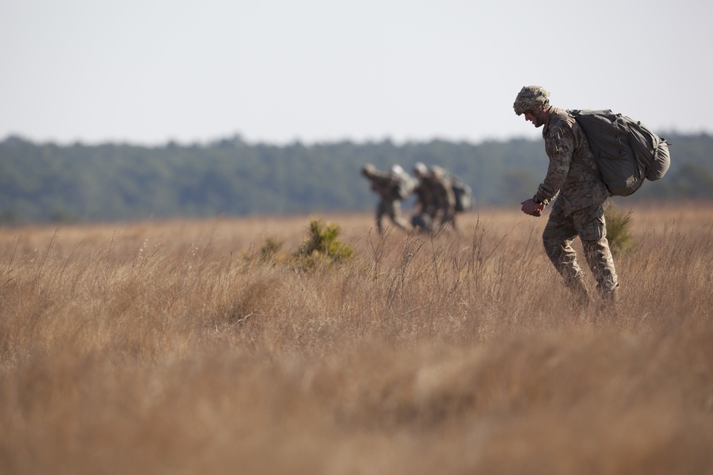 U.S Army paratroopers returns after completing their jump in participation for the 20th Annual Randy Oler Memorial Operation Toy Drop, hosted by U. S. Army Civil Affairs &amp; Psychological Operations Command (Airborne), Dec. 01, 2017 on Sicily Drop Zone at F