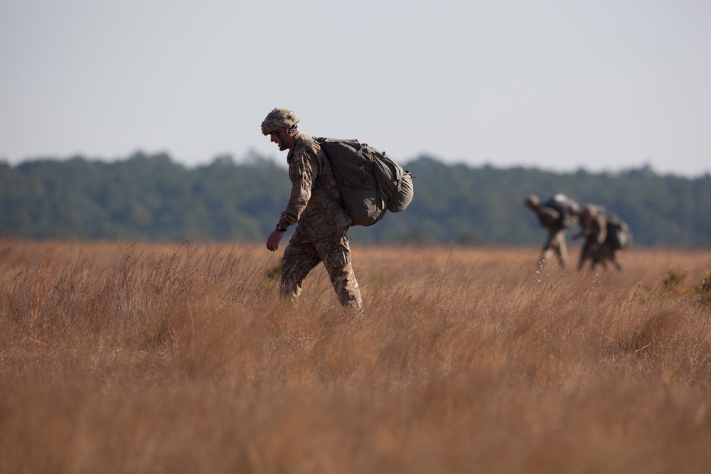 U.S Army paratroopers returns after completing their jump in participation for the 20th Annual Randy Oler Memorial Operation Toy Drop, hosted by U. S. Army Civil Affairs &amp; Psychological Operations Command (Airborne), Dec. 01, 2017 on Sicily Drop Zone at F