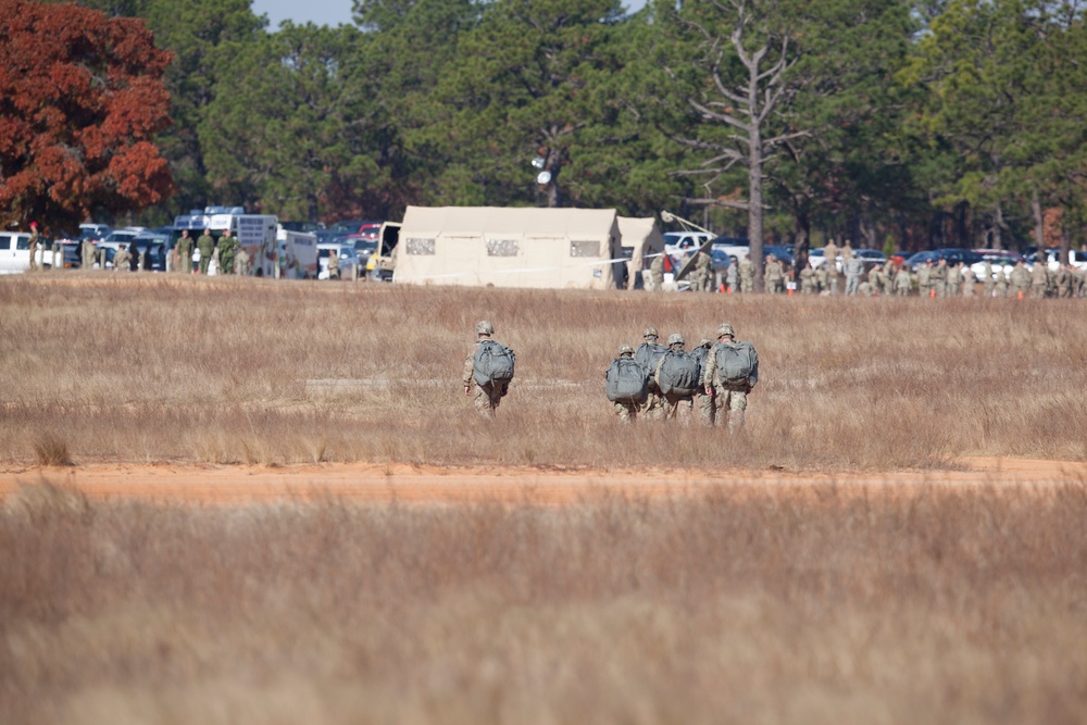 U.S Army paratroopers returns after completing their jump in participation for the 20th Annual Randy Oler Memorial Operation Toy Drop, hosted by U. S. Army Civil Affairs &amp; Psychological Operations Command (Airborne), Dec. 01, 2017 on Sicily Drop Zone at F