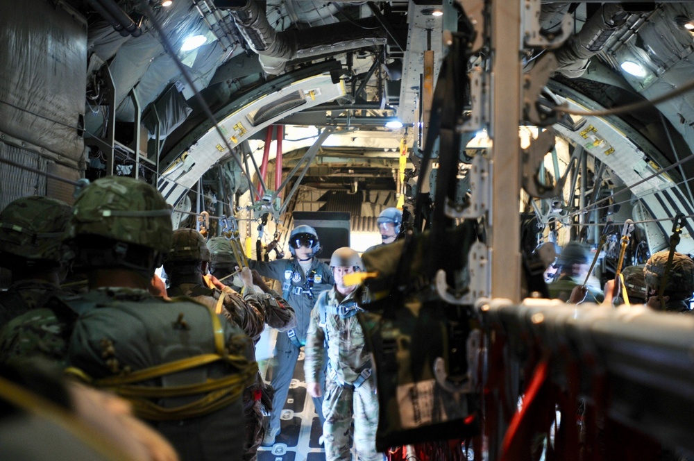 Army paratroopers stationed at Ft. Bragg get ready to exit a U.S. Air Force C-130 Hercules as part of Operation Toy Drop