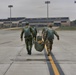 Joint crew of U.S and Swedish jumpmasters disembark a U.S. Air Force C-130 Hercules after fifty-four paratroopers exited the plane