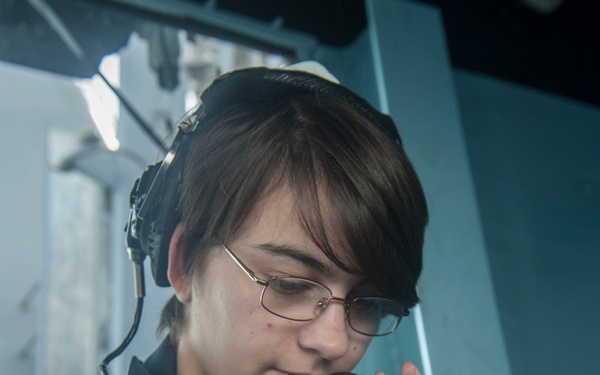 USS America Sailor records reports from CIC