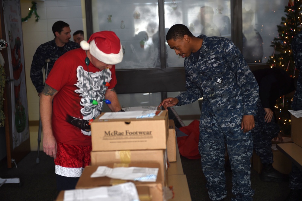 Santa passes out the new Type III Uniforms