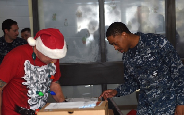 Santa passes out the new Type III Uniforms