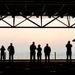 Sailors and Marines lookout to the sunset