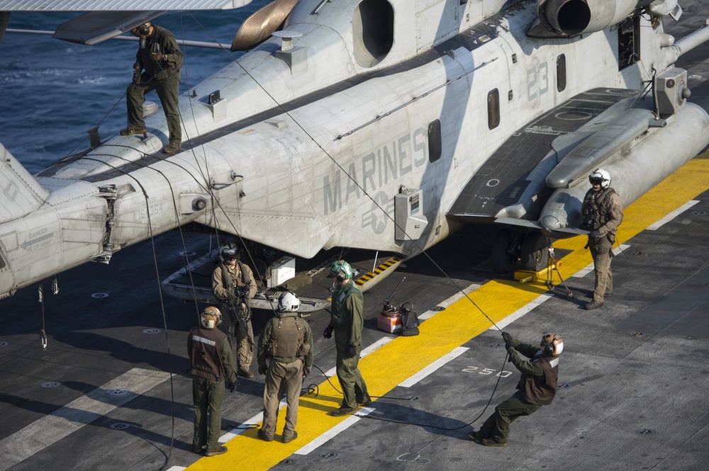USS America aircraft is is prepared to move to the hangar bay