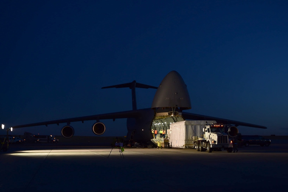 Units work together to transport weather satellite