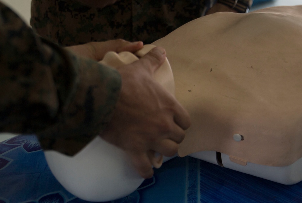 U.S. Navy, Malaysian Armed Forces medical officers teach basic life-saving skills to Malaysian school teachers