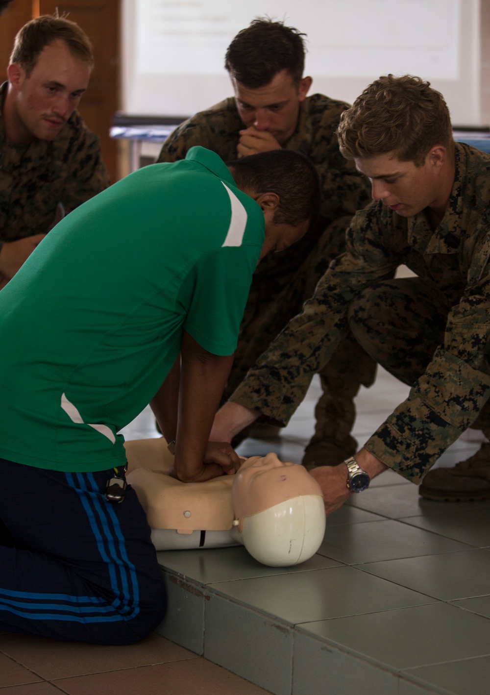 U.S. Navy, Malaysian Armed Forces medical officers teach basic life-saving skills to Malaysian school teachers