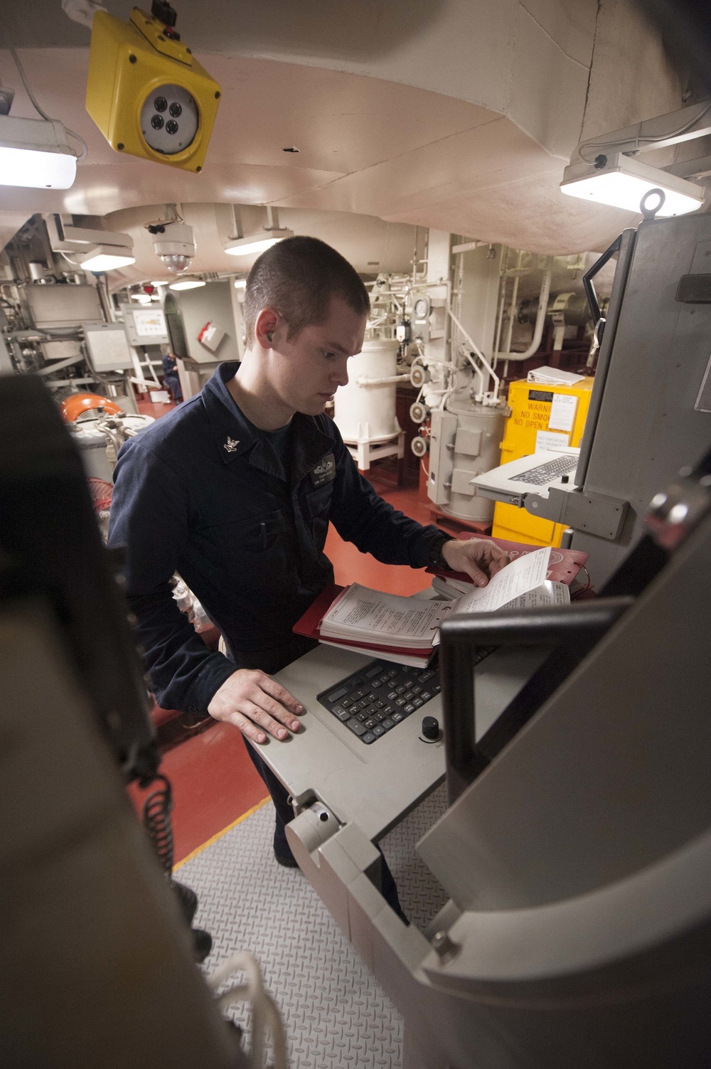 USS America Sailor checks equipment