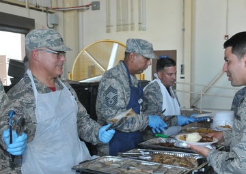 Col. Raymond Figueroa, Commander of the 156th Airlift Wing, Serves Meal at 156th Airlift Wing Holiday