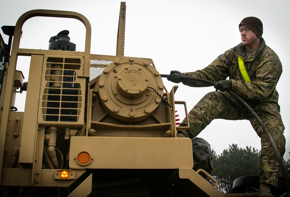 US Soldiers load equipment