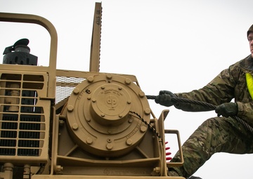 US Soldiers load equipment