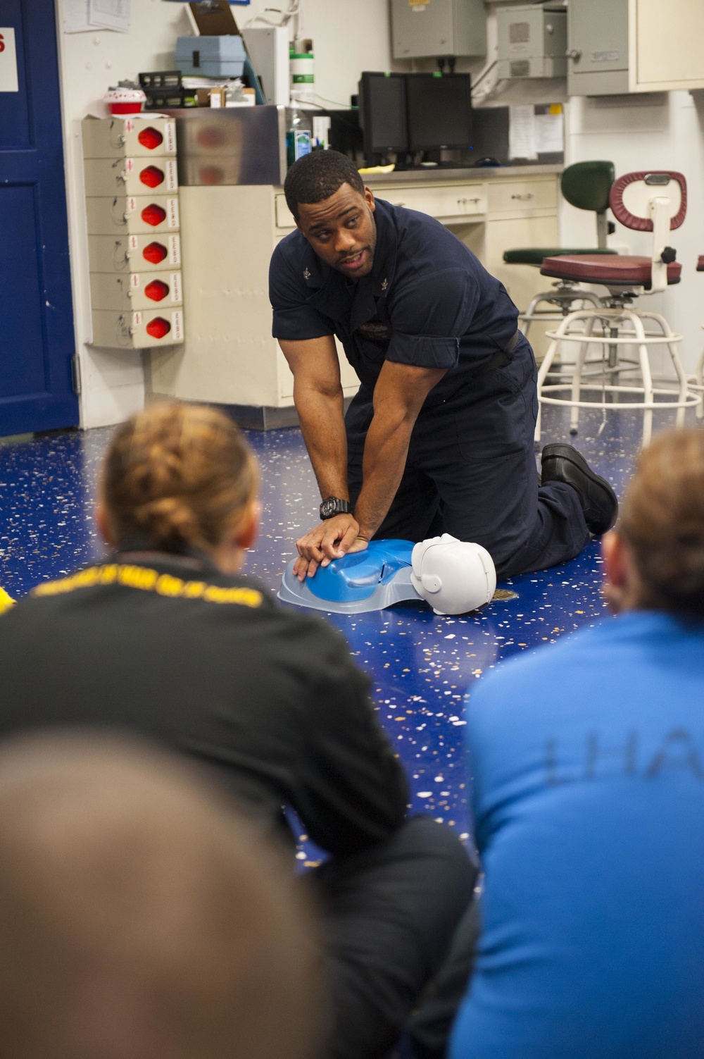 Hospital Corpsman teaches USS America Sailors CPR basics