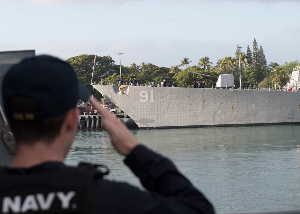 USS Lake Erie (CG 70) Sailor salutes USS Pinckney