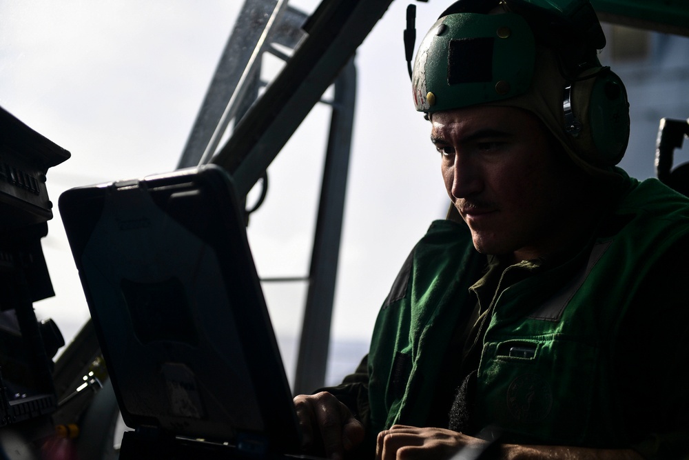 USS San Diego (LPD 22) Embarked Marine Runs Computer Diagnostics on UH-1Y Venom