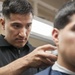 15th MEU Marine cuts hair in barbershop