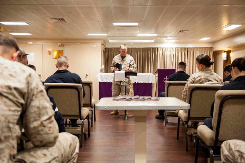 Chaplain delivers sermon during Protestant worship service on USS America