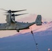 Marines fast rope in front of Volcano