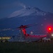 Marines fast rope in front of volcano