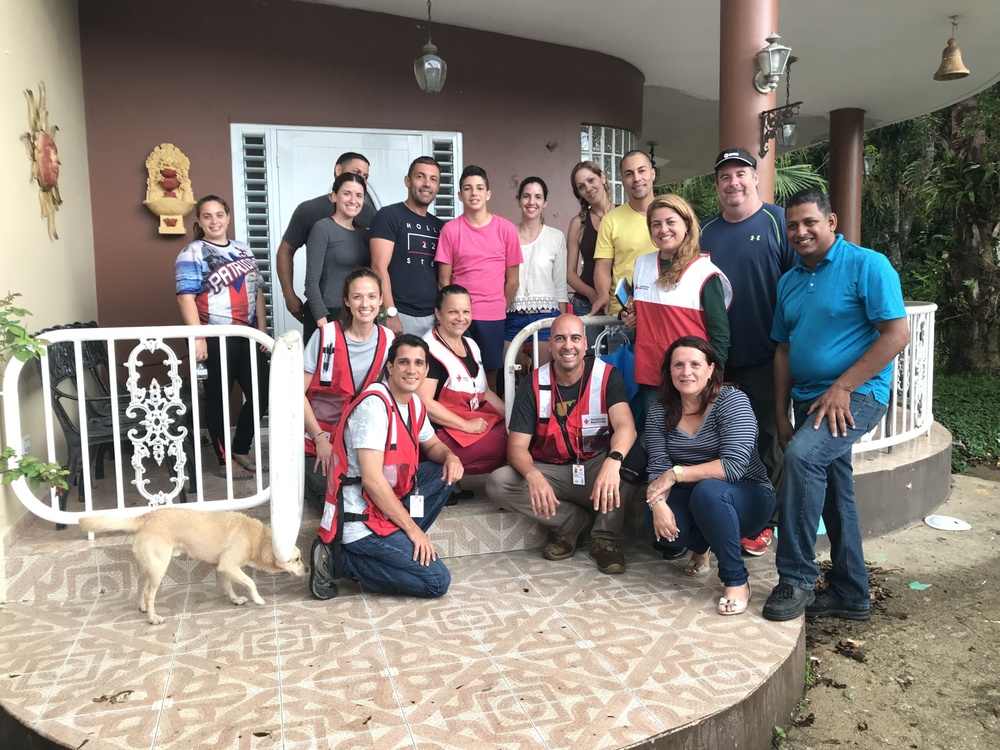 Red Cross team with family from Adjuntas municipality