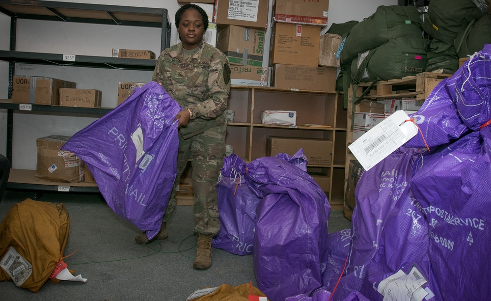 US Soldiers working mail and morale