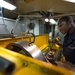 Sailor Operates Lathe