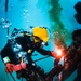 UCT-2, MDSU-1, USS Emory S. Land, and USS Frank Cable Divers Conduct Underwater Cutting Operations on Big Blue Mooring System in Apra Harbor