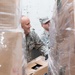 102nd Intelligence Wing Airmen receive and prepare wreaths for Wreaths Across America Event