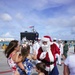 Santa Delivers Candy Canes During Asheville Arrival to Guam