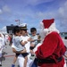 Santa Delivers Candy Canes During Asheville Arrival to Guam