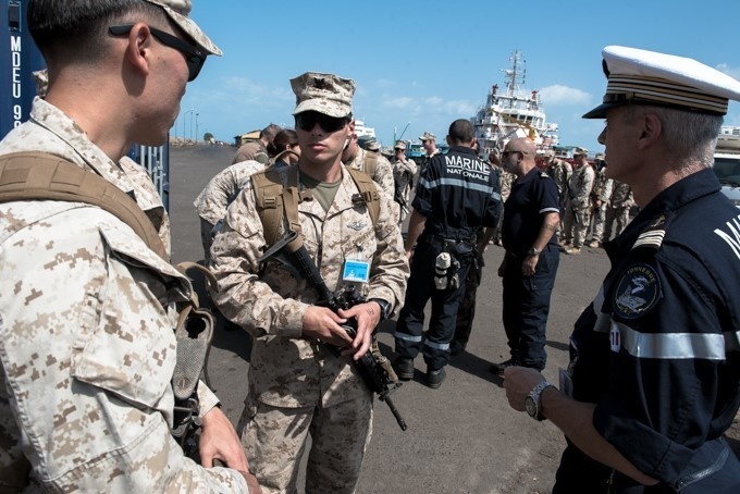 U.S. Marines coordinate with French military prior to embarking aboard Tonnerre