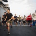 USS America (LHA 6) Sailors and Marines participate in 5k run on flight deck