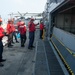 America Sailors handle ordnance
