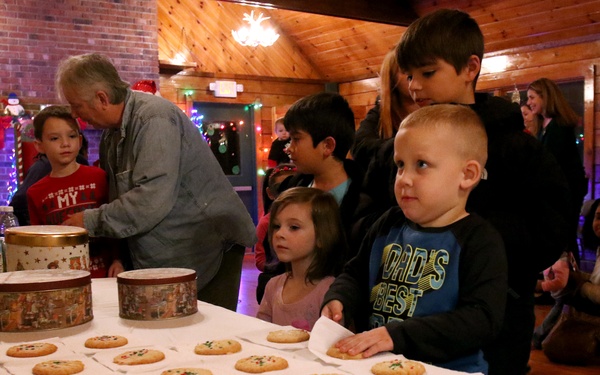 EFMP family members enjoy Story Time with Santa