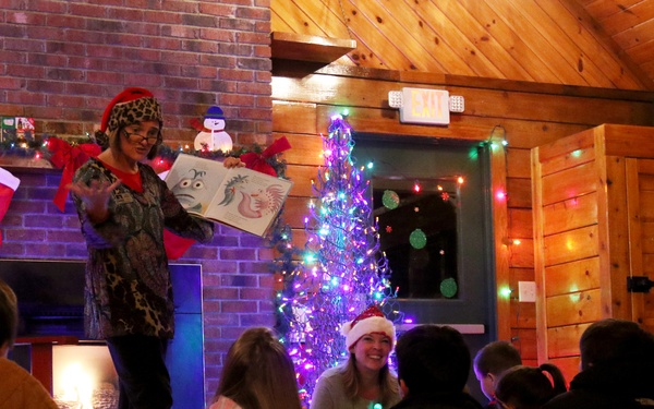 EFMP family members enjoy Story Time with Santa