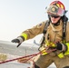 Airman participate in a firefighter combat challenge