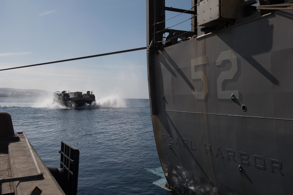 USS Pearl Harbor Sailors backload equipment