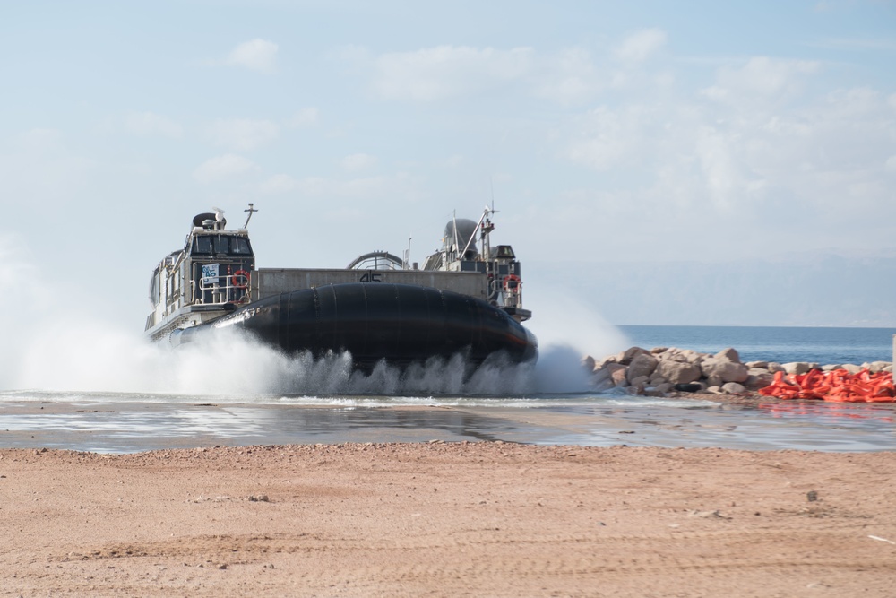 USS Pearl Harbor Sailors backload equipment