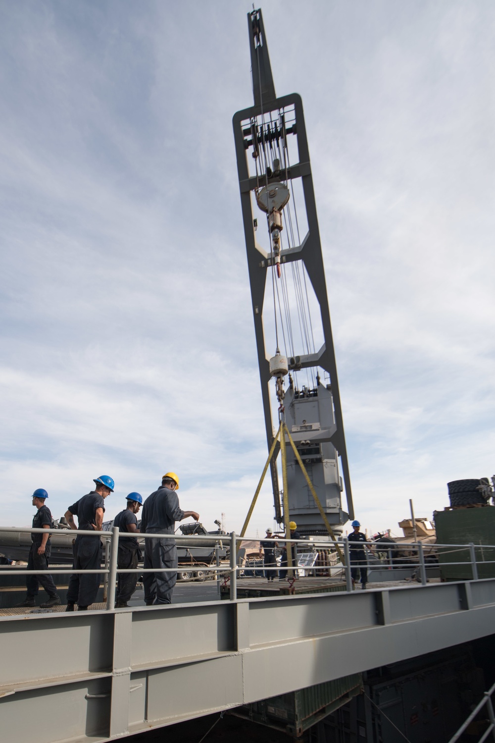 USS Pearl Harbor Sailors backload equipment