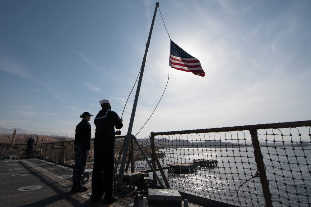 USS Pearl Harbor Sailors backload equipment