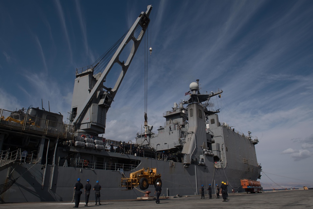 USS Pearl Harbor Sailors backload equipment