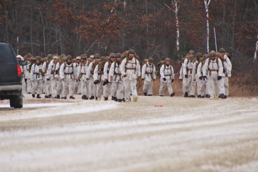 Cold-Weather Operations Course 18-01 students, all Marines, march to training at Fort McCoy