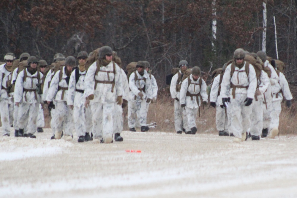 Cold-Weather Operations Course 18-01 students, all Marines, march to training at Fort McCoy