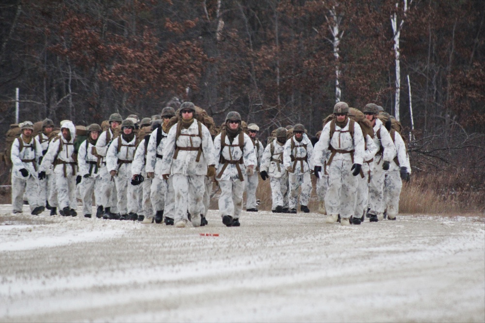 Cold-Weather Operations Course 18-01 students, all Marines, march to training at Fort McCoy