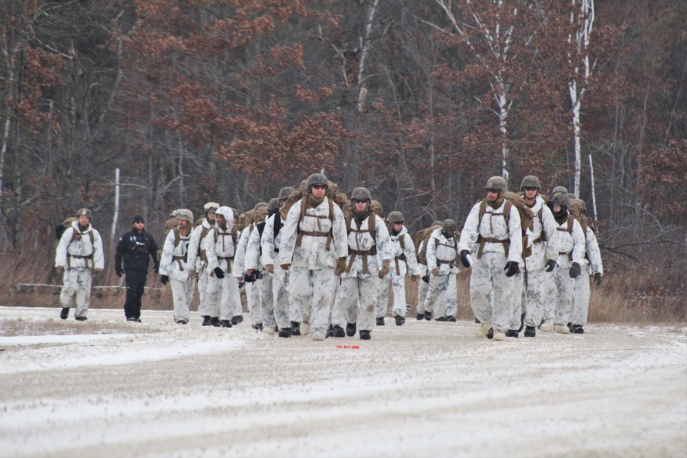 Cold-Weather Operations Course 18-01 students, all Marines, march to training at Fort McCoy