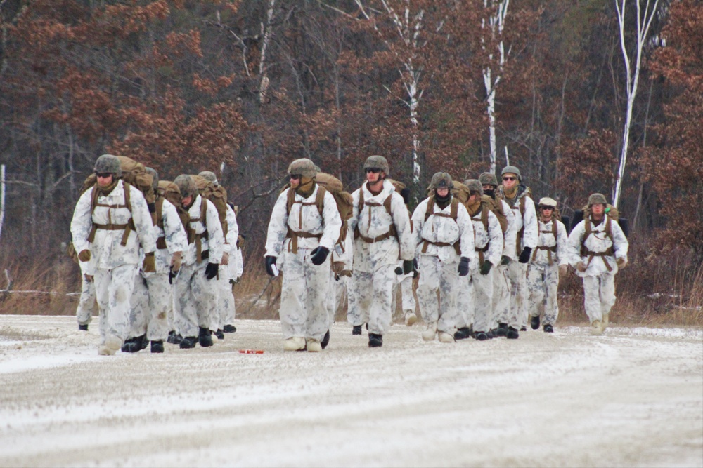 Cold-Weather Operations Course 18-01 students, all Marines, march to training at Fort McCoy